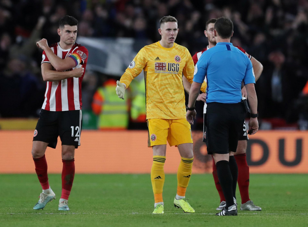 Soccer Football - Premier League - Sheffield United v Newcastle United - Bramall Lane, Sheffield, Britain - December 5, 2019 Sheffield United&amp;#39;s Dean Henderson remonstrates with referee Stuart Attwell after a goal was awarded to Newcastle by VAR Action Images via Reuters/Lee Smith EDITORIAL USE ONLY. No use with unauthorized audio, video, data, fixture lists, club/league logos or ”live” services. Online in-match use limited to 75 images, no video emulation. No use in betting, games or single club/league/player publications. Please contact your account representative for further details.