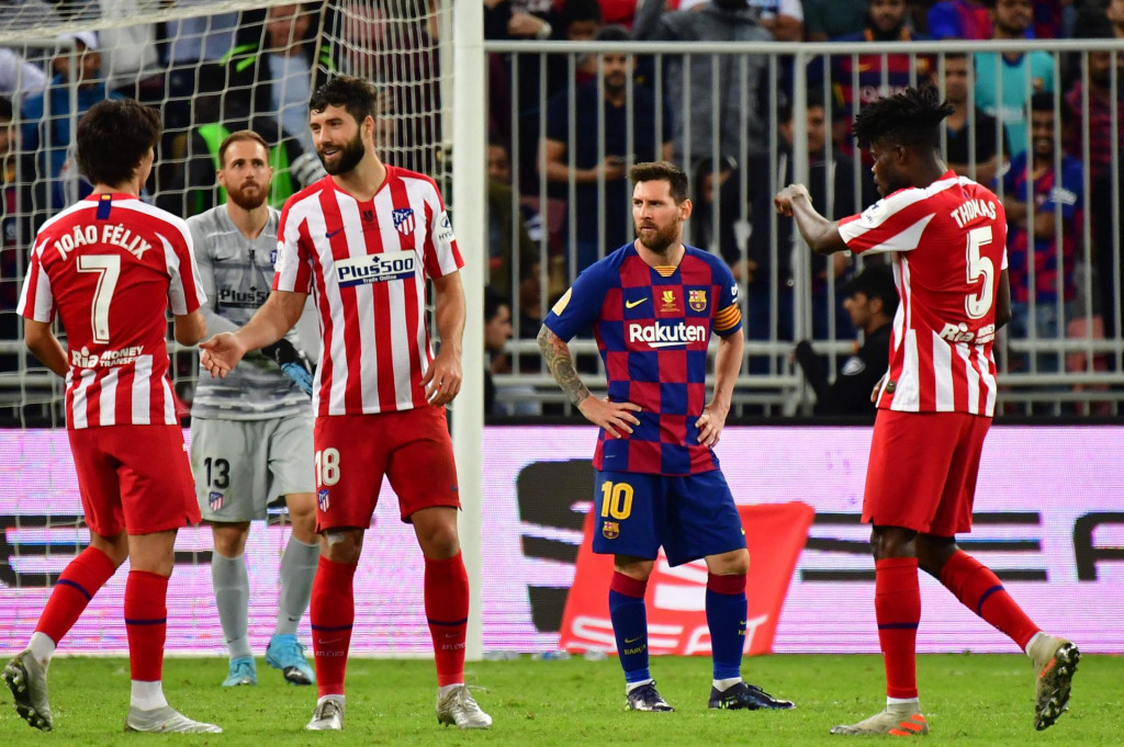 Barcelona&amp;#39;s Argentine forward Lionel Messi (2nd-R) react to the loss following the Spanish Super Cup semi final between Barcelona and Atletico Madrid on January 9, 2020, at the King Abdullah Sport City in the Saudi Arabian port city of Jeddah. - The winner will face Real Madrid in the final on January 12. (Photo by Giuseppe CACACE/AFP)