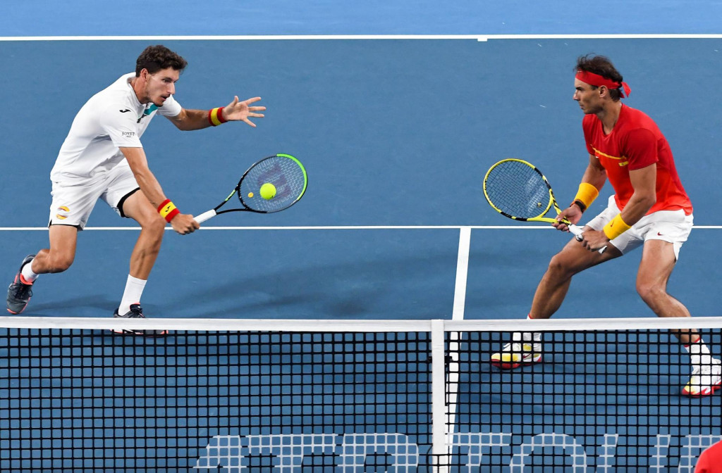 Rafael Nadal (R) and Pablo Carreno Busta (L) of Spain return the ball in their men&amp;#39;s double match against Sander Gille and Joran Vliegen of Belgium at the ATP Cup tennis tournament in Sydney on January 10, 2020. (Photo by William WEST/AFP)/--IMAGE RESTRICTED TO EDITORIAL USE - NO COMMERCIAL USE--