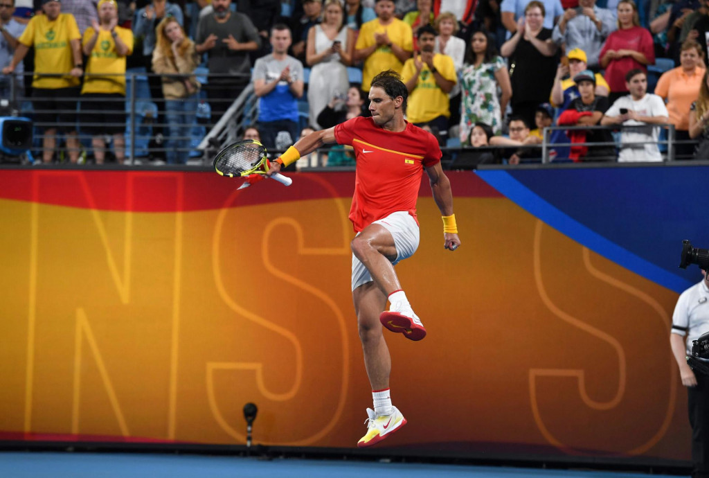 Rafael Nadal of Spain leaps for joy after winning his men&amp;#39;s singles match against Alex de Minaur of Australia at the ATP Cup tennis tournament in Sydney on January 11, 2020. (Photo by William WEST/AFP)/--IMAGE RESTRICTED TO EDITORIAL USE - NO COMMERCIAL USE--