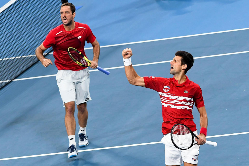 CORRECTION - Viktor Troicki (L) and Novak Djokovic (R) of Serbia celebrate winning the first set in their men&amp;#39;s doubles match against Pablo Carreno Busta and Feliciano Lopez of Spain in the final of the ATP Cup tennis tournament in Sydney on January 13, 2020. (Photo by William WEST/AFP)/-- IMAGE RESTRICTED TO EDITORIAL USE - STRICTLY NO COMMERCIAL USE --/�The erroneous mention[s] appearing in the metadata of this photo by William WEST has been modified in AFP systems in the following manner: [13] instead of [12]. Please immediately remove the erroneous mention[s] from all your online services and delete it (them) from your servers. If you have been authorized by AFP to distribute it (them) to third parties, please ensure that the same actions are carried out by them. Failure to promptly comply with these instructions will entail liability on your part for any continued or post notification usage. Therefore we thank you very much for all your attention and prompt action. We are sorry for the inconvenience this notification may cause and remain at your disposal for any further information you may require.�