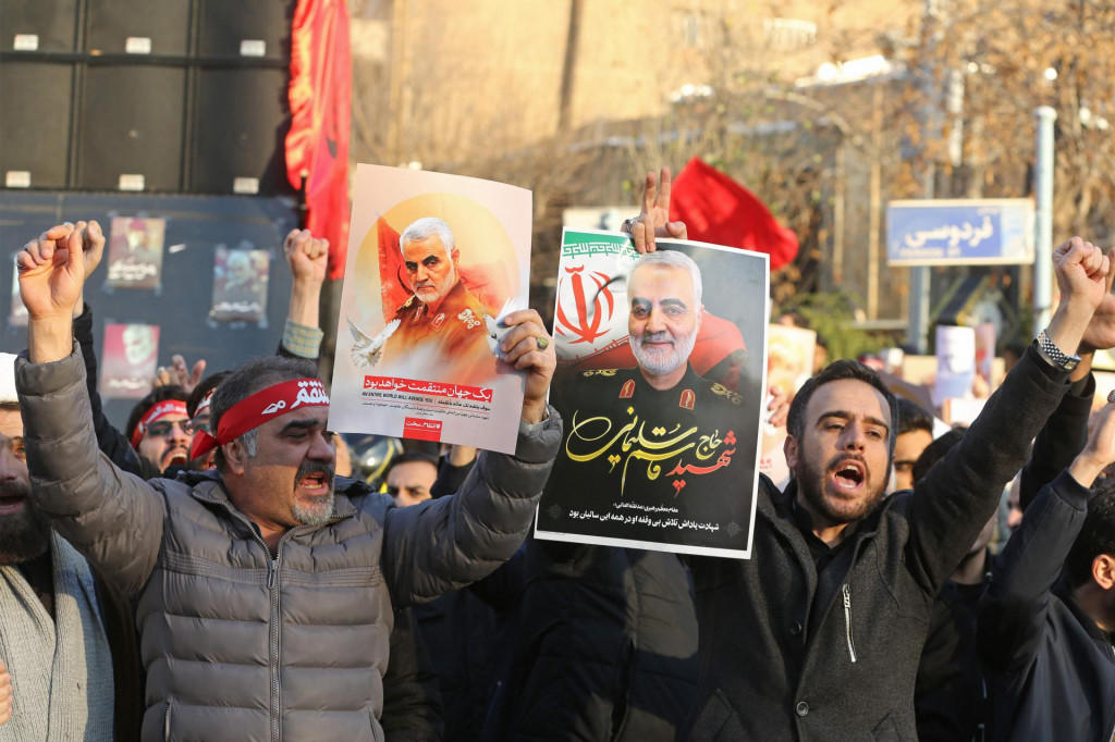 Iranian demonstrators hold placards bearing the image of slain military commander Qasem Soleimani in front of the British embassy in the capital Tehran on January 12, 2020 following the British ambassador&amp;#39;s arrest for allegedly attending an illegal demonstration. - Chanting ”Death to Britain”, up to 200 protesters rallied outside the mission a day after the brief arrest of British ambassador Rob Macaire at a memorial for those killed when a Ukraine airliner was shot down. (Photo by ATTA KENARE/AFP)
