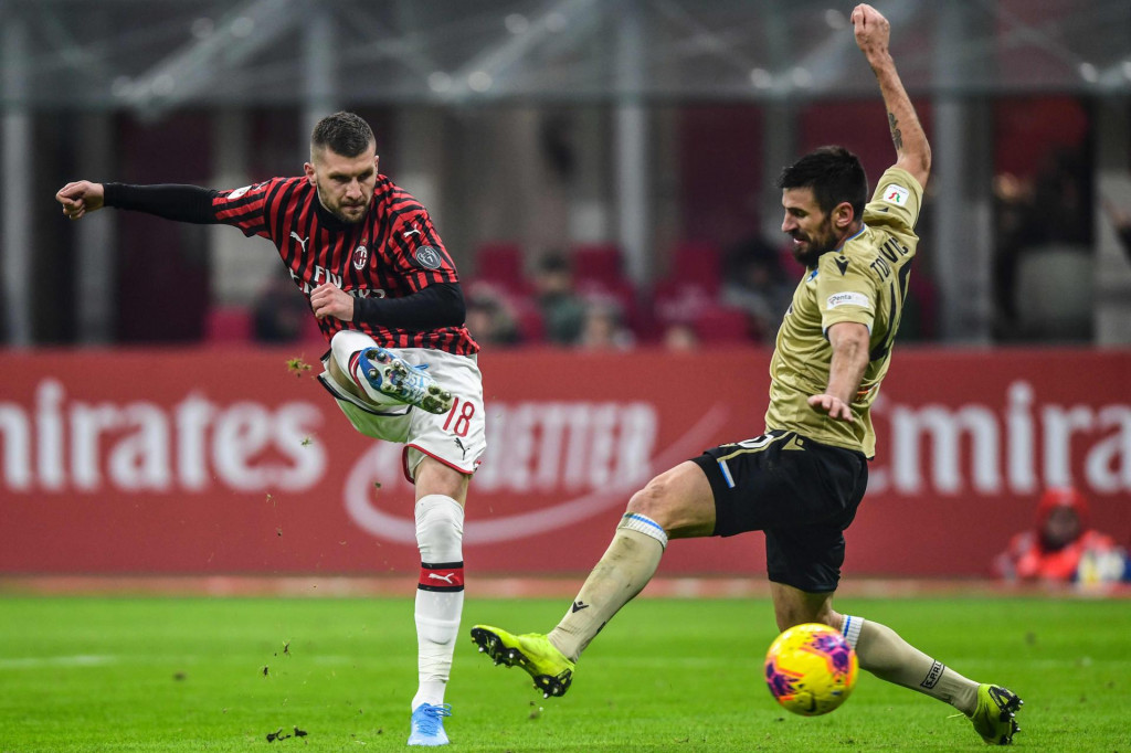 AC Milan&amp;#39;s Croatian forward Ante Rebic (L) shoots past Spal&amp;#39;s Serbian defender Nenad Tomovic during the Italian Cup (Coppa Italia) round of 16 football match AC Milan vs SPAL on January 15, 2020 at the San Siro stadium in Milan. (Photo by Miguel MEDINA/AFP)