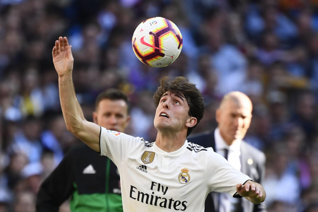 (FILES) This file photo taken on March 16, 2019 shows Real Madrid&amp;#39;s Spanish defender Alvaro Odriozola as he plays the ball during the Spanish league football match between Real Madrid CF and RC Celta de Vigo at the Santiago Bernabeu stadium in Madrid. - Bayern Munich confirmed on January 22, 2020 the signing of Real Madrid right-back Alvaro Odriozola on loan until the end of their season to boost their back four. (Photo by GABRIEL BOUYS/AFP)