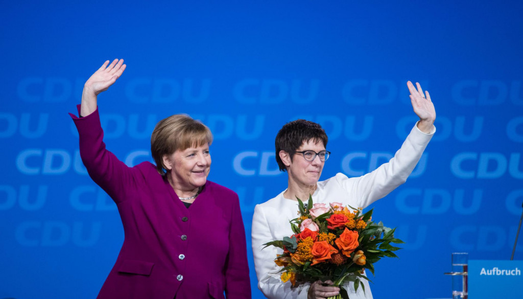(FILES) This file photo taken on February 26, 2018 shows then Saarland&amp;#39;s State Premier and politician of the Christian Democratic Union (CDU) Annegret Kramp-Karrenbauer (R) and German Chancellor Angela Merkel standing on the stage after Kramp-Karrenbauer was elected new secretary general of the party during the CDU&amp;#39;s party congress in Berlin. - Annegret Kramp-Karrenbauer, the woman widely seen as German Chancellor Angela Merkel&amp;#39;s chosen successor, will not lead her crisis-racked CDU party into upcoming elections, a party source told AFP on February 10, 2020. (Photo by Stefanie LOOS/AFP)