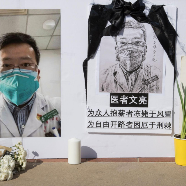 A memorial for Dr Li Wenliang, who was the whistleblower of the Coronavirus, Covid-19, that originated in Wuhan, China and caused the doctors death in that city, is pictured outside the UCLA campus in Westwood, California, on February 15, 2020. - The death toll from the new coronavirus outbreak surpassed 1,600 in China on Sunday, with the first fatality reported outside Asia fuelling global concerns. (Photo by Mark RALSTON/AFP)