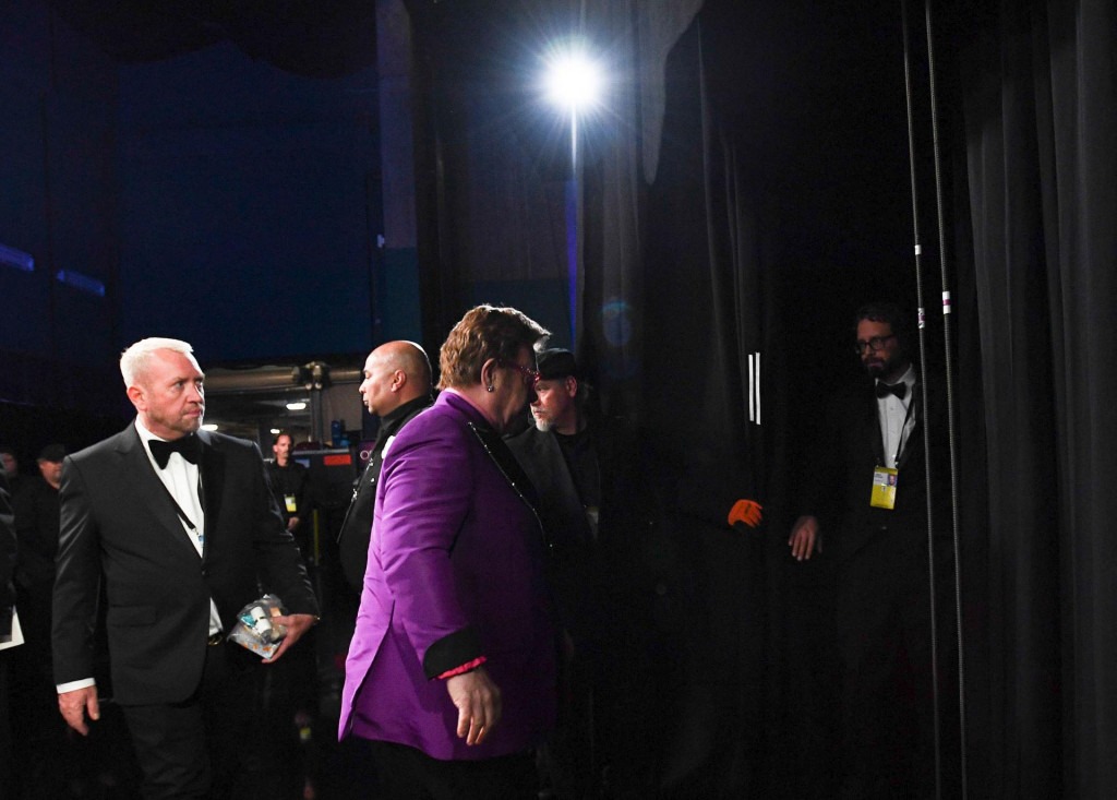 In this photo provided by A.M.P.A.S., Elton John walks to the main stage during the 92nd Oscars at the Dolby Theatre in Hollywood, California on February 9, 2020. (Photo by Richard Harbaugh/AMPAS/AFP)/RESTRICTED TO EDITORIAL USE - MANDATORY CREDIT ”AFP PHOTO/AMPAS/ Richard HARBAUGH” - NO MARKETING - NO ADVERTISING CAMPAIGNS - DISTRIBUTED AS A SERVICE TO CLIENTS