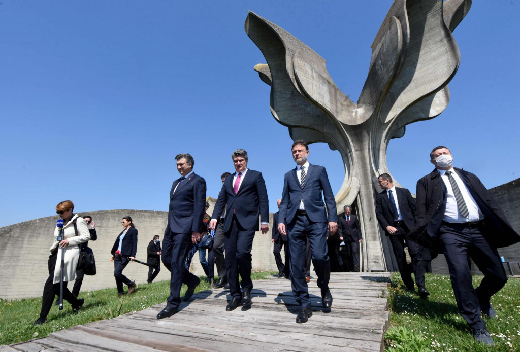 Croatian Pariament Speaker Gordan Jandrokovic (R), Croatian President Zoran Milanovic (C) and Croatian Prime Minister Andrej Plenkafterovic (L) leave the flower-shaped monument after a ceremony in tribute to tens of thousands of victims killed in the concentration camp of Jasenovac during the World War II, on April 22, 2020. - Croatia&amp;#39;s Jews, Serbs and Roma joined an official commemoration for the victims of a World War II death camp for the first time in five years Wednesday, after snubbing the event to protest a resurgence of Nazi ideology. Known as Croatia&amp;#39;s Auschwitz, the Jasenovac camp was run by the Nazi-allied Ustasha regime, which persecuted and killed hundreds of thousands of ethnic Serbs, Jews, Roma and anti-fascist Croatians during the war. (Photo by Denis LOVROVIC/AFP)