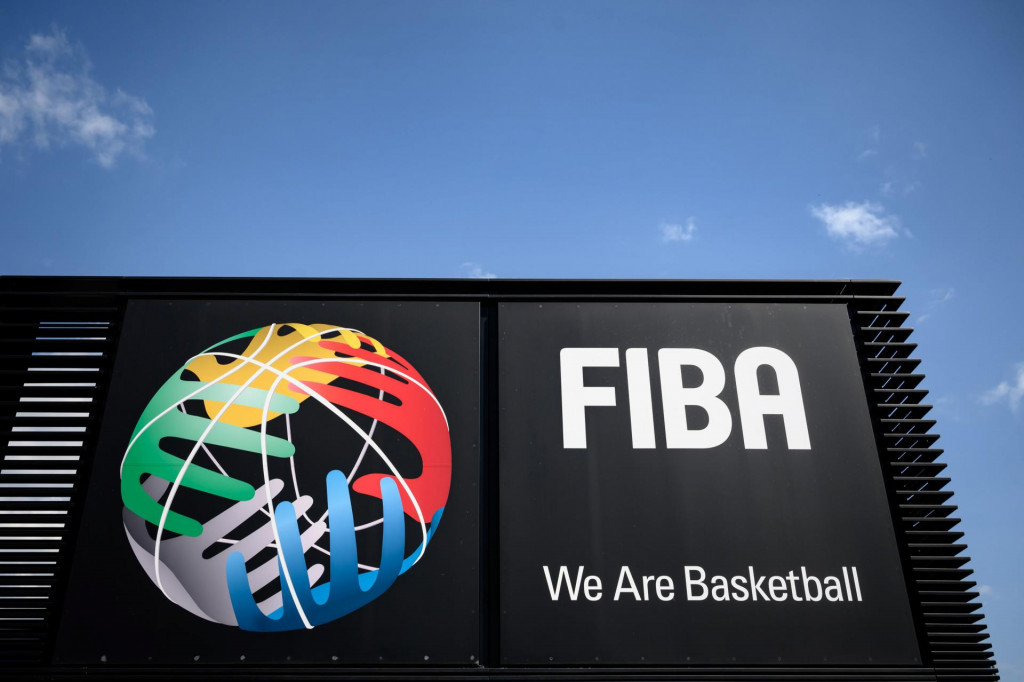 A picture taken on April 24, 2020 in Mies, shows a board at the entrance of the International Basketball Federation FIBA, as Switzerland remains in lockdown during the COVID-19 outbreak, caused by the novel coronavirus. - Short-time working, drawdowns from reserves, bank loans or call for help to the Intenational Olympic Committee, the hitherto prosperous international sports federations are suffering from the cancellation or postponement of their events caused by the coronavirus pandemic, which deprives them of income. (Photo by Fabrice COFFRINI/AFP)
