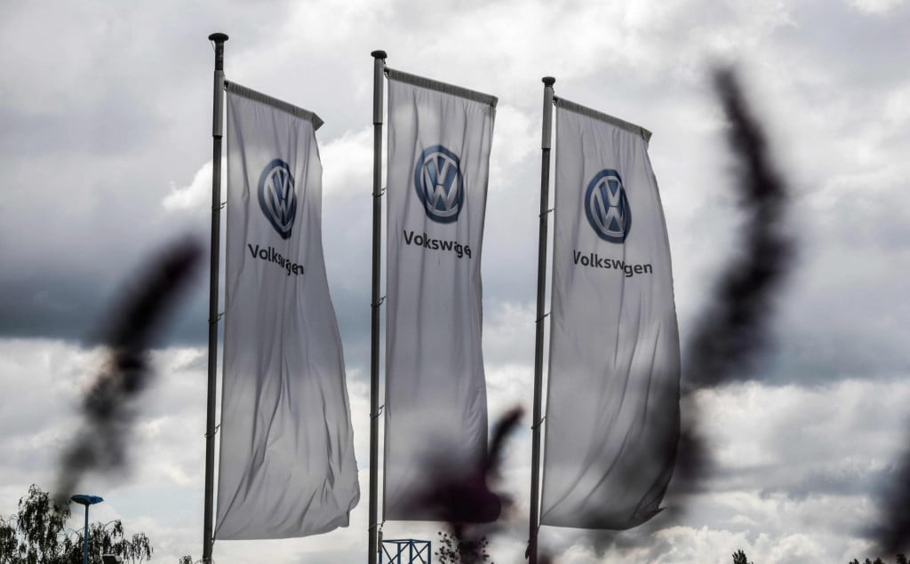 The logo of German car maker Volkswagen (VW) is seen on flags fluttering in front of a car dealer in Hamm, western Germany on May 25, 2020. - Judges at the Federal Court of Justice (BGH) ruled Monday, May 25, 2020 that Volkswagen must buy back a diesel car it modified to appear less polluting, a decision that could influence outcomes in thousands of other ”Dieselgate” cases. (Photo by Ina FASSBENDER/AFP)