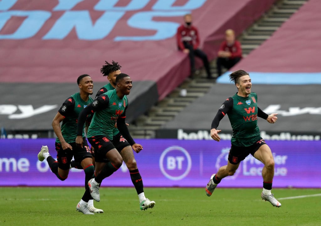 Aston Villa&amp;#39;s English midfielder Jack Grealish (R) runs to celebrate scoring the opening goal during the English Premier League football match between West Ham United and Aston Villa at The London Stadium, in east London on July 26, 2020. (Photo by Matt Dunham/POOL/AFP)/RESTRICTED TO EDITORIAL USE. No use with unauthorized audio, video, data, fixture lists, club/league logos or &amp;#39;live&amp;#39; services. Online in-match use limited to 120 images. An additional 40 images may be used in extra time. No video emulation. Social media in-match use limited to 120 images. An additional 40 images may be used in extra time. No use in betting publications, games or single club/league/player publications./