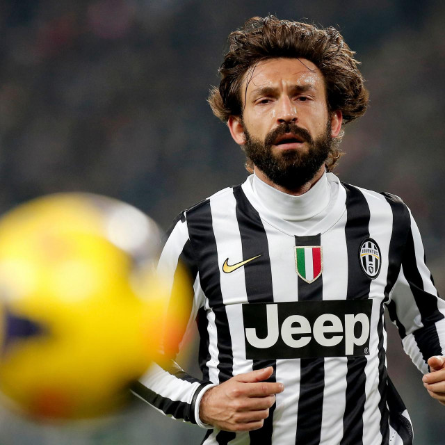(FILES) In this file photo taken on February 23, 2014 Juventus&amp;#39; Italian midfielder Andrea Pirlo eyes the ball during the Italian Serie A football match between Juventus and Torino at Juventus Stadium in Turin. - Andrea Pirlo was named as new Juventus coach - club on August 8, 2020. (Photo by Marco BERTORELLO/AFP)