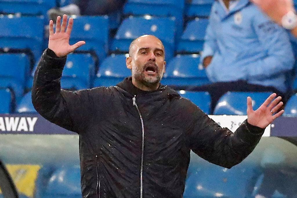 Manchester City&amp;#39;s Spanish manager Pep Guardiola gestures on the touchline during the English Premier League football match between Leeds United and Manchester City at Elland Road in Leeds, northern England on October 3, 2020. (Photo by JASON CAIRNDUFF/POOL/AFP)/RESTRICTED TO EDITORIAL USE. No use with unauthorized audio, video, data, fixture lists, club/league logos or &amp;#39;live&amp;#39; services. Online in-match use limited to 120 images. An additional 40 images may be used in extra time. No video emulation. Social media in-match use limited to 120 images. An additional 40 images may be used in extra time. No use in betting publications, games or single club/league/player publications./