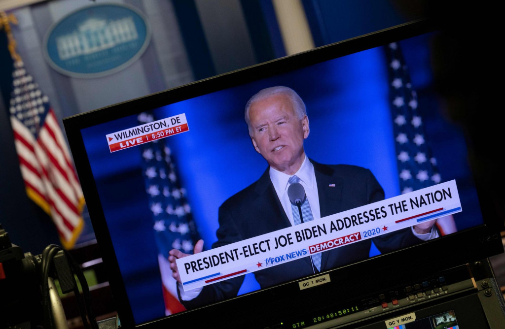 US President-elect Joe Biden is seen, as he give his acceptance speech, on a monitor in the Brady Briefing Room in the White House in Washington, DC on November 7, 2020. (Photo by ANDREW CABALLERO-REYNOLDS/AFP)