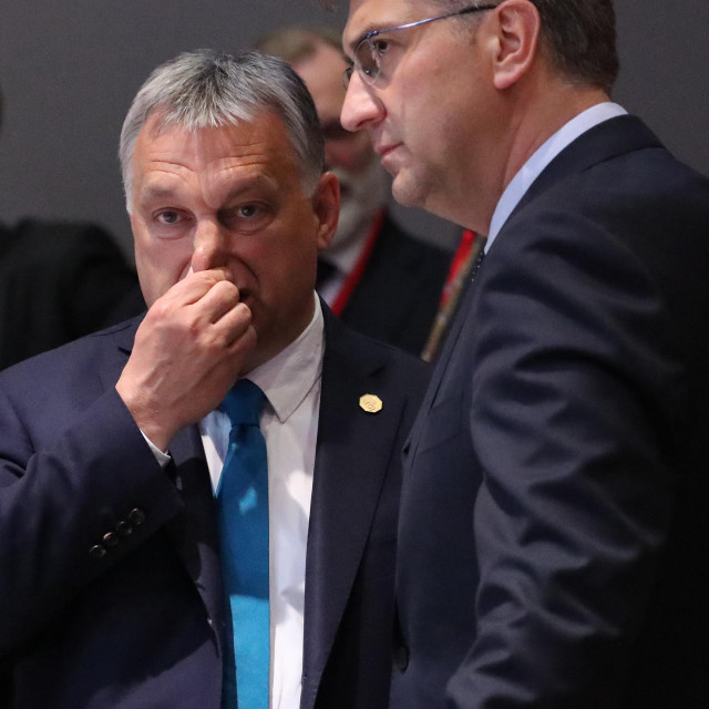 Hungarian Prime Minister Viktor Orban (L) and Croatia&amp;#39;s Prime Minister Andrej Plenkovic speak ahead of a dinner at a European Union (EU) summit at EU Commission Headquarters in Brussels on May 28, 2019. (Photo by YVES HERMAN/POOL/AFP)