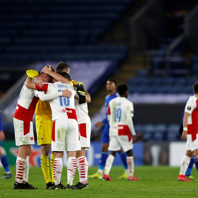 Prague players celebrate their win on the pitch after the UEFA Europa League Round of 32, 2nd leg football match between Leicester City and Slavia Prague at King Power Stadium in Leicester, central England on February 25, 2021. - Slavia Prague won the game and tie 2-0. (Photo by Adrian DENNIS/AFP)