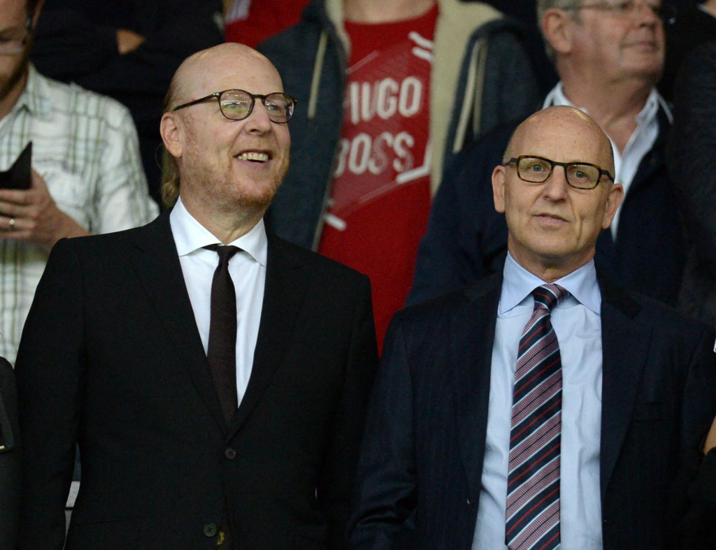 (FILES) In this file photo taken on August 19, 2016 Manchester United&amp;#39;s US co-chairmen Joel Glazer (R) and Avram Glazer (L) attend the English Premier League football match between Manchester United and Southampton at Old Trafford in Manchester, north west England. - Twelve of Europe&amp;#39;s most powerful clubs announced the launch of a breakaway European Super League on April 19, 2021 in a potentially seismic shift in the way football is run, but faced accusations of greed and cynicism. Six Premier League teams, Liverpool, Manchester United, Arsenal, Chelsea, Manchester City and Tottenham are involved, alongside Real Madrid, Barcelona, Atletico Madrid, Juventus, Inter Milan and AC Milan. Real Madrid chief Florentino Perez, who was announced as the first ESL president, said the breakaway reflected the big clubs&amp;#39; wishes. (Photo by Oli SCARFF/AFP)/RESTRICTED TO EDITORIAL USE. No use with unauthorized audio, video, data, fixture lists, club/league logos or &amp;#39;live&amp;#39; services. Online in-match use limited to 75 images, no video emulation. No use in betting, games or single club/league/player publications./
