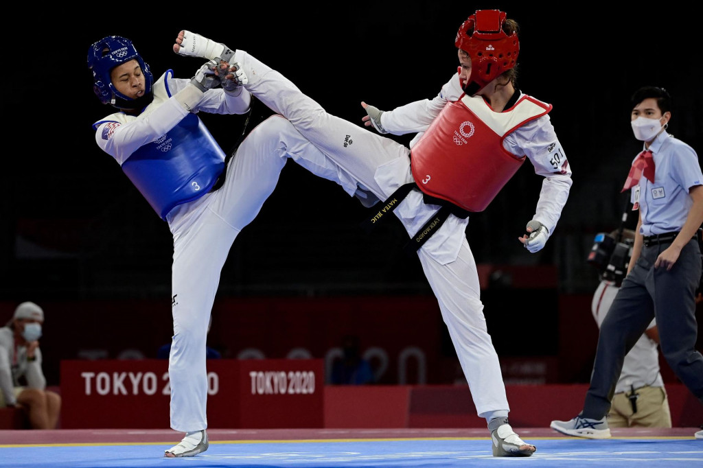 USA&amp;#39;s Paige Mc Pherson (Blue) and Croatia&amp;#39;s Matea Jelic (Red) compete in the taekwondo women&amp;#39;s -67kg semi-final bout during the Tokyo 2020 Olympic Games at the Makuhari Messe Hall in Tokyo on July 26, 2021. (Photo by Javier SORIANO/AFP)