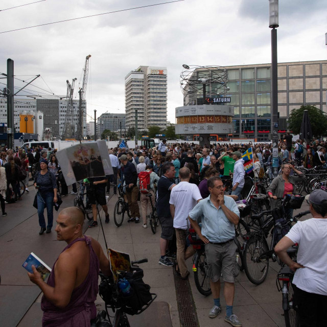People demonstrate against Germany&amp;#39;s coronavirus restrictions to curb the spread of the COVID-19 virus at Alexanderplatz in Berlin, on August 01, 2021. - Thousands of demonstrators defied a court-ordered protest ban and gathered in the streets of Berlin. (Photo by PAUL ZINKEN/AFP)