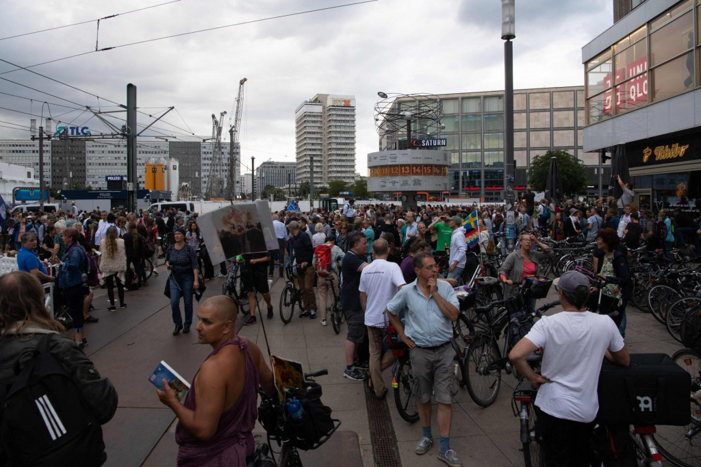 People demonstrate against Germany&amp;#39;s coronavirus restrictions to curb the spread of the COVID-19 virus at Alexanderplatz in Berlin, on August 01, 2021. - Thousands of demonstrators defied a court-ordered protest ban and gathered in the streets of Berlin. (Photo by PAUL ZINKEN/AFP)