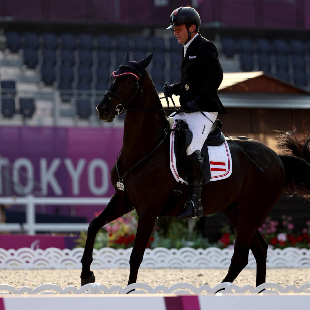Austria&amp;#39;s Pepo Puch riding Sailor&amp;#39;s Blue competes in the equestrian dressage individual test grade II during the Tokyo 2020 Paralympic Games at Equestrian Park in Tokyo on August 26, 2021. (Photo by Behrouz MEHRI/AFP)