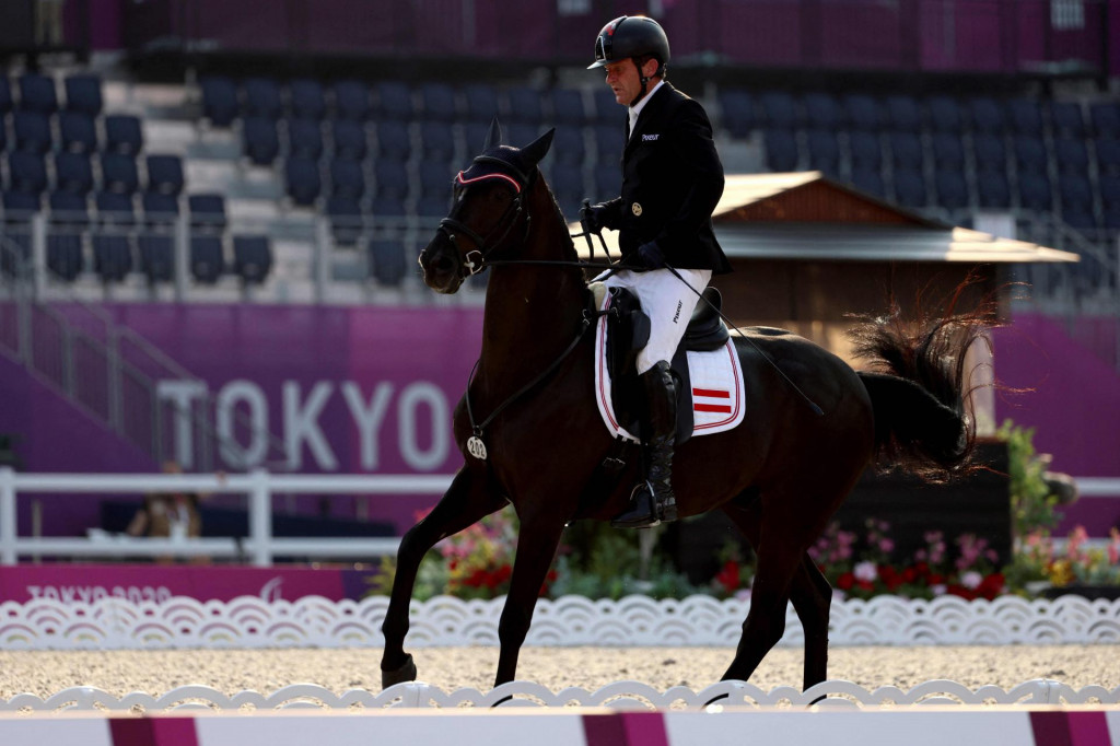 Austria&amp;#39;s Pepo Puch riding Sailor&amp;#39;s Blue competes in the equestrian dressage individual test grade II during the Tokyo 2020 Paralympic Games at Equestrian Park in Tokyo on August 26, 2021. (Photo by Behrouz MEHRI/AFP)