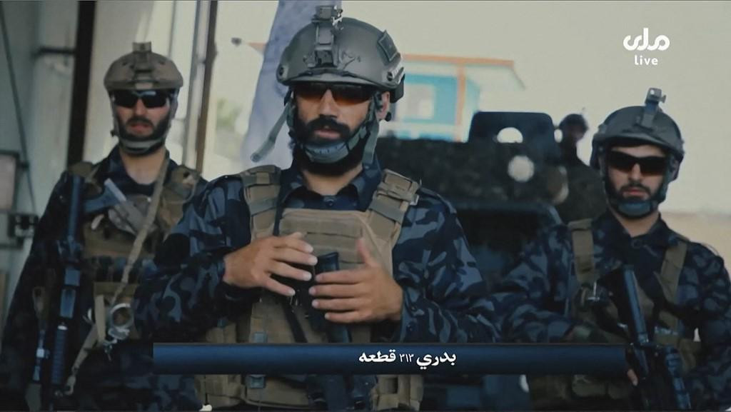 Scena iz propagandnog videa prikazanog na afganistanskoj televiziji prikazuje talibanske specijalne snage koje patroliraju ulicama u Afganistanu