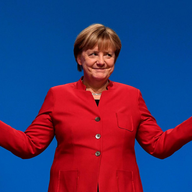 (FILES) This file photo taken on December 6, 2016 shows German Chancellor Angela Merkel gesturing after addressing delegates during her conservative Christian Democratic Union (CDU) party&amp;#39;s congress in Essen, western Germany. - Wrapping up a historic 16 years in power with an uncertain legacy at home and abroad, Germany&amp;#39;s ”eternal chancellor” Angela Merkel, 67, leaves office with her popularity so resilient she would likely have won a record fifth term had she wanted to extend her mandate. (Photo by TOBIAS SCHWARZ/AFP)/TO GO WITH AFP ELECTION PACKAGE on AUGUST 26, 2021