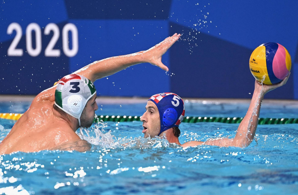 Hungary&amp;#39;s Krisztian Manhercz (L) challenges Croatia&amp;#39;s Maro Jokovic during the Tokyo 2020 Olympic Games men&amp;#39;s water polo quarter-final match between Hungary and Croatia at the Tatsumi Water Polo Centre in Tokyo on August 4, 2021. (Photo by Angela Weiss/AFP)