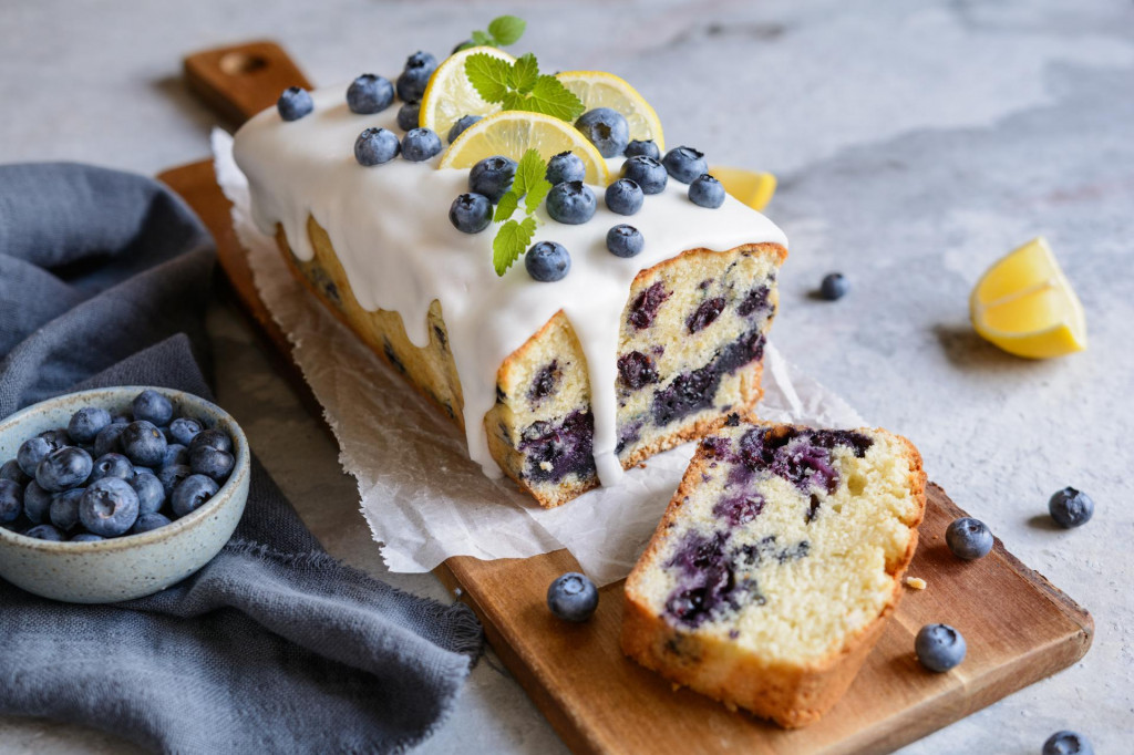 Fresh lemon blueberry loaf of bread cake with sugar glaze