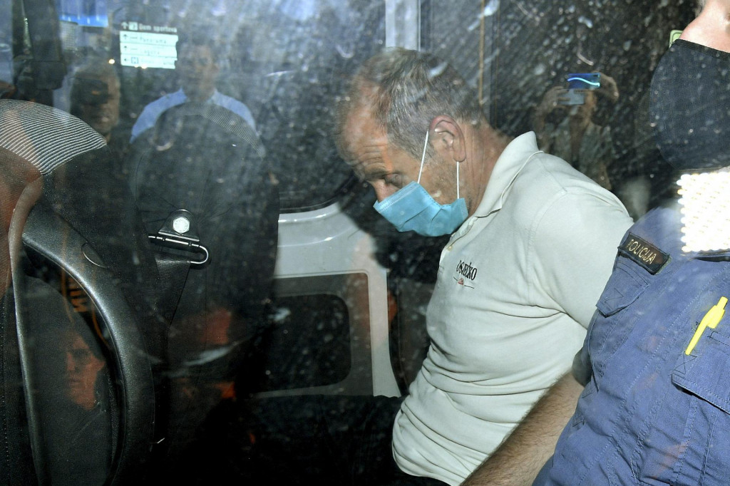 Na fotografiji: Harald Kopitz u pratnji policije odveden iz Državnog odvjetništva