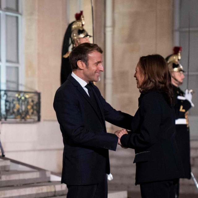 France&amp;#39;s President Emmanuel Macron (L) welcomes US Vice President Kamala Harris prior to a meeting at the Elysee Palace in Paris on November 10, 2021. - US Vice President Kamala Harris meets with French President Emmanuel Macron on November 10 in a further effort to mend relations with Paris after a crisis sparked by a cancelled submarines contract. (Photo by )