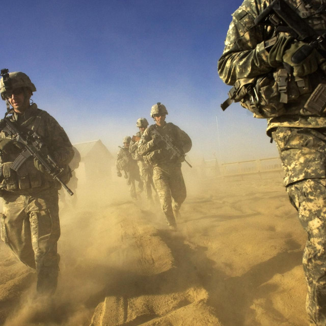 (FILES) In this file photo taken on November 28, 2008, US Army soliders from 1-506 Infantry Division set out on a patrol in Paktika province, situated along the Afghan-Pakistan border. - The Pentagon on November 19, 2020 announced plans to slash troop levels in Afghanistan to its lowest levels in nearly 20 years of conflict after President Trump pledged to end a war that has killed about 2,400 US soldiers and cost the American taxpayer more than $ 1 trillion since 2001. (Photo by DAVID FURST/AFP)