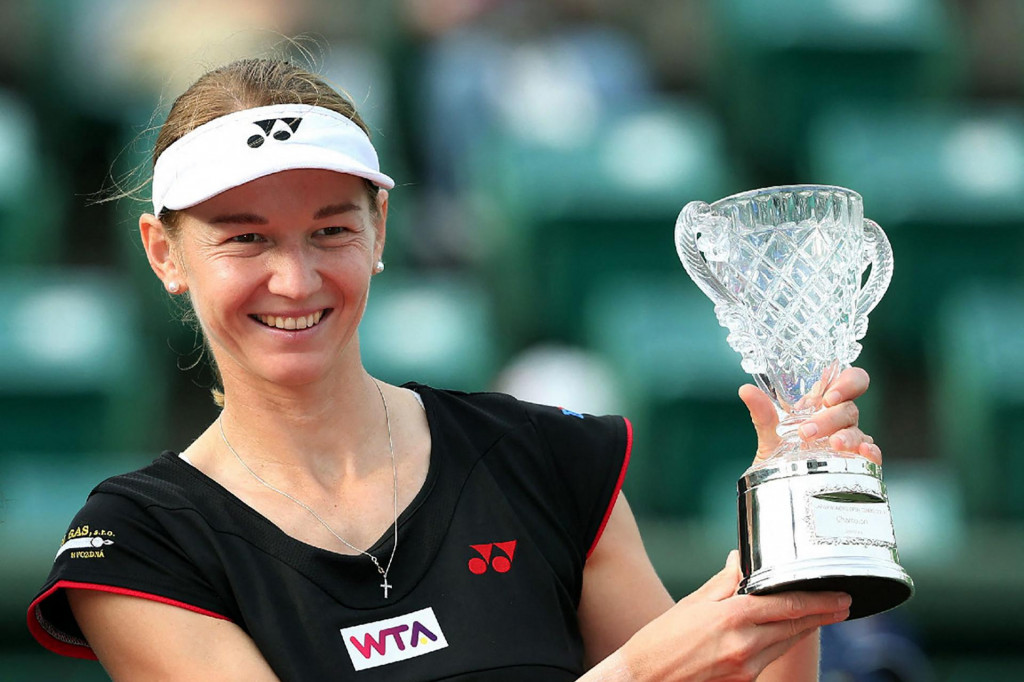 (FILES) In this file photo taken on October 12, 2014 the Czech Republic&amp;#39;s Renata Voracova poses with her trophy after winning the women&amp;#39;s doubles final at the Japan Women&amp;#39;s Open tennis tournament in Osaka, western Japan. - Czech tennis player Renata Voracova has ended up in the same detention as Serbian star Novak Djokovic in the run-up to the Australian Open, the Czech foreign ministry said on January 7, 2022. ”Renata Voracova is in the same detention as Djokovic, together with several other tennis players, that is, in Melbourne,” the ministry told AFP in an e-mail. (Photo by JIJI PRESS/AFP)