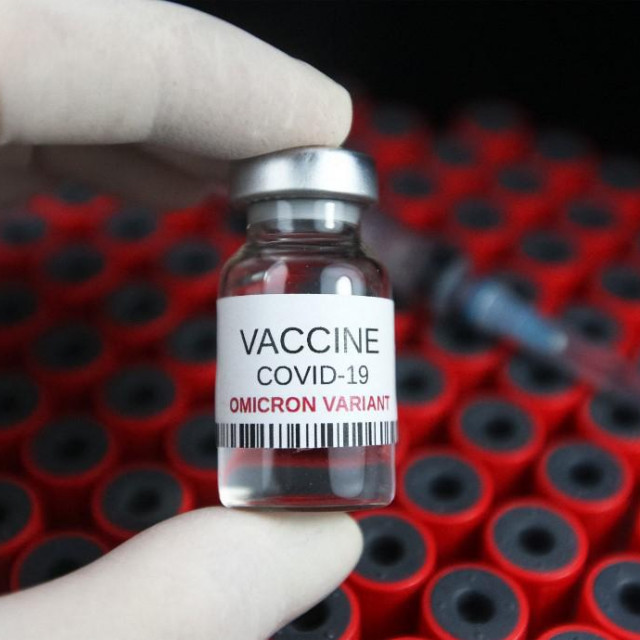 A vial labeled &amp;#39;Vaccine COVID-19 Omicron variant&amp;#39; is pictured in this illustration photo of a new coronavirus SARS-CoV-2 variant B.1.1.529, taken in Kyiv on 02 December, 2021. (Photo by STR/NurPhoto) (Photo by NurPhoto/NurPhoto via AFP)