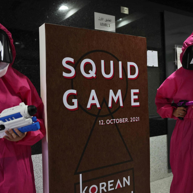 Participants take part in an event where they play the games of Netflix smash hit &rdquo;Squid Game&rdquo; at the Korean Cultural Centre in Abu Dhabi, on October 12, 2021. - A dystopian vision of a polarised society, &rdquo;Squid Game&rdquo; blends a tight plot, social allegory and uncompromising violence to create the latest South Korean cultural phenomenon to go global. (Photo by Giuseppe CACACE/AFP)