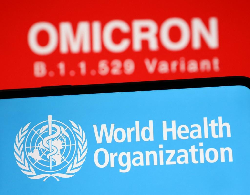 ANKARA, TURKEY - NOVEMBER 29: In this photo new COVID-19 variant: Omicron (B.1.1.529) is displayed on a screen and the logo of World Health Organisation is seen front in Ankara, Turkey on November 29, 2021. Hakan Nural/Anadolu Agency (Photo by Hakan Nural/ANADOLU AGENCY/Anadolu Agency via AFP)