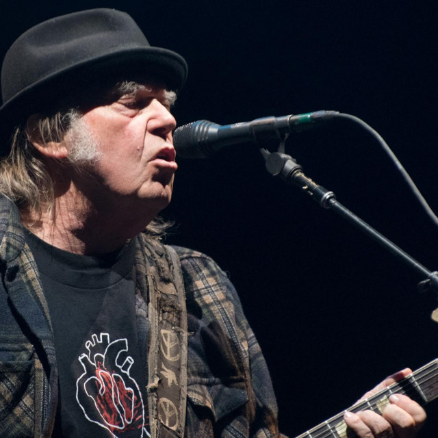 (FILES) In this file photo taken on July 7, 2018 Neil Young performs on stage for his first time in Quebec City during 2018 Festival d&amp;#39;Ete. - 2022 mark the 50th anniversary of legendary albums. (Photo by Alice Chiche/AFP)
