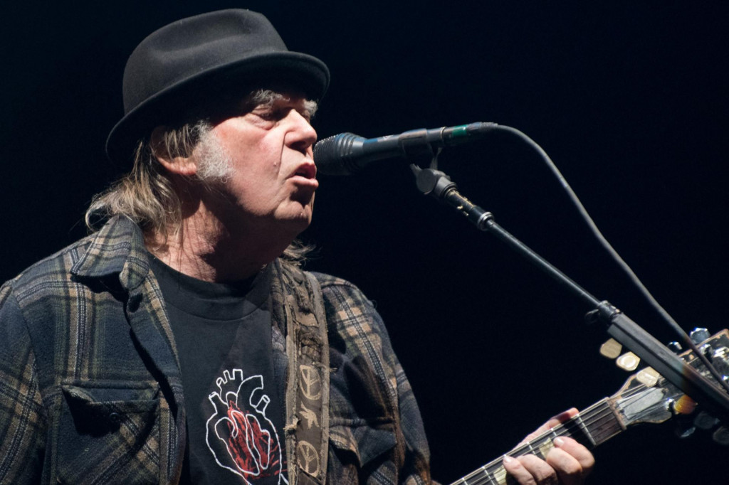 (FILES) In this file photo taken on July 7, 2018 Neil Young performs on stage for his first time in Quebec City during 2018 Festival d&amp;#39;Ete. - 2022 mark the 50th anniversary of legendary albums. (Photo by Alice Chiche/AFP)