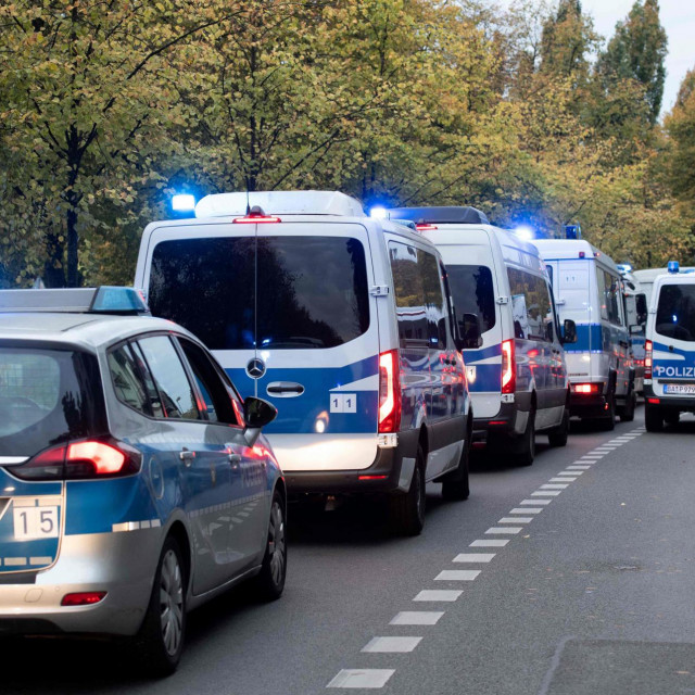 Police cars are seen as policemen prepare for expected protests against the eviction of the so-called &amp;#39;Koepi&amp;#39; trailer camp at Koepenicker Strasse in Berlin&amp;#39;s Mitte district bordering Kreuzberg on October 15, 2021. - A police operation was underway to clear the left autonomous trailer camp and evict its inhabitants. In June 2021, the Berlin district court had ordered the evacuation of the 2,600 square meter property with the trailers following a complaint by the property owner who plans the development of the area. Inhabitants had set up barricades around the camp to avoid the eviction. (Photo by Paul ZINKEN/AFP)