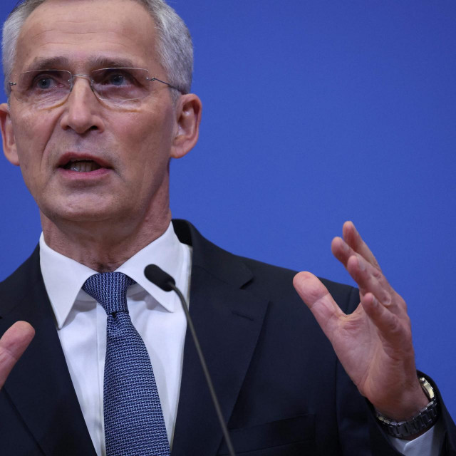 NATO Secretary General Jens Stoltenberg gestures as he delivers a speech during a press conference after a NATO video summit on Russia invasion of Ukraine at the NATO headquarters in Brussels on February 25, 2022. (Photo by Kenzo Tribouillard/AFP)