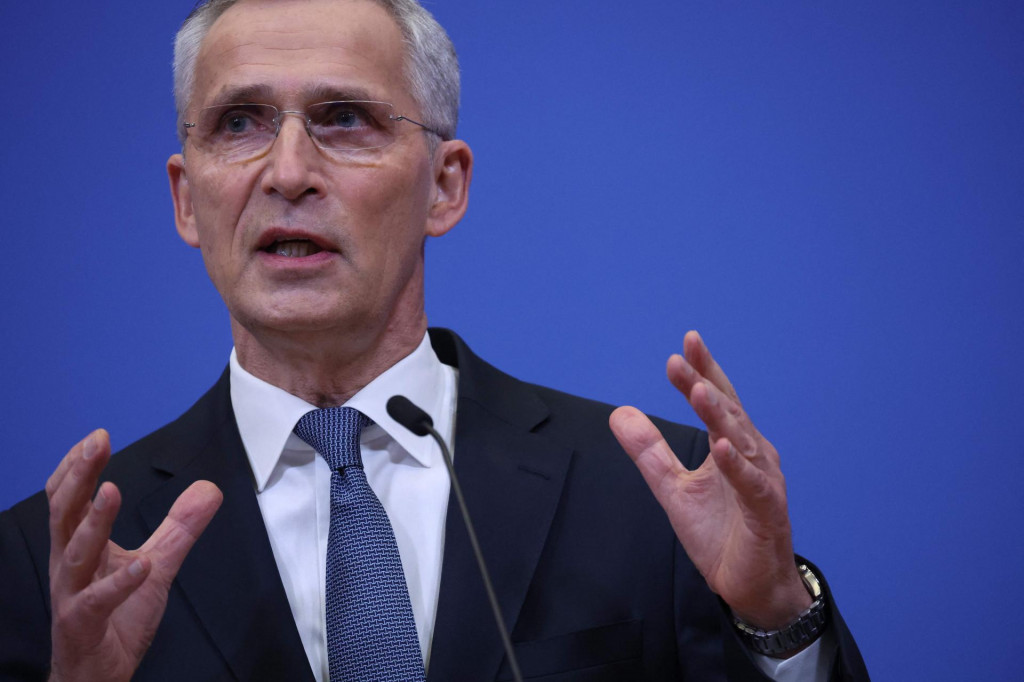 NATO Secretary General Jens Stoltenberg gestures as he delivers a speech during a press conference after a NATO video summit on Russia invasion of Ukraine at the NATO headquarters in Brussels on February 25, 2022. (Photo by Kenzo Tribouillard/AFP)