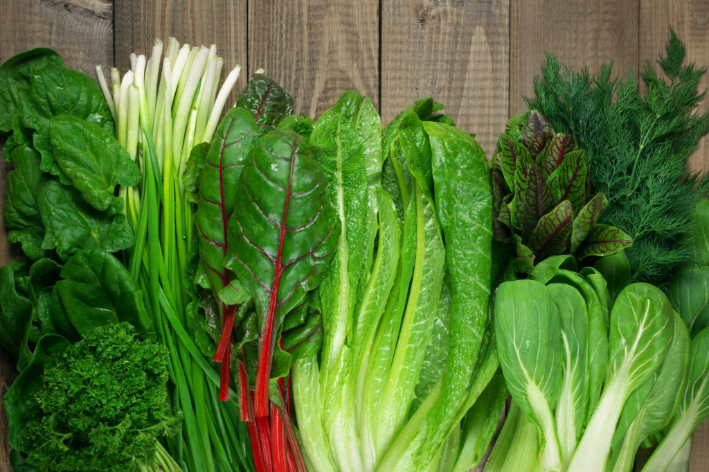 &lt;p&gt;Spring vitamin set of various green leafy vegetables on rustic wooden table. Top view point.&lt;/p&gt;
