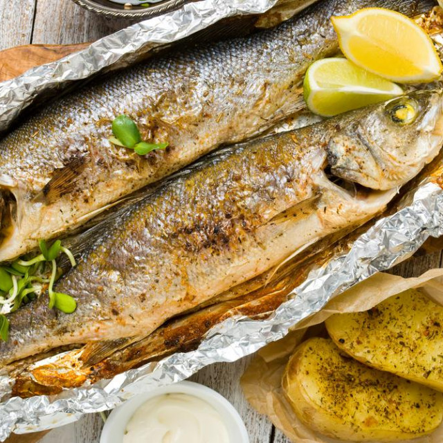 &lt;p&gt;Riba Fresh baked fish sea bass (Dicentrarchus labrax) on a light wooden background&lt;/p&gt;

