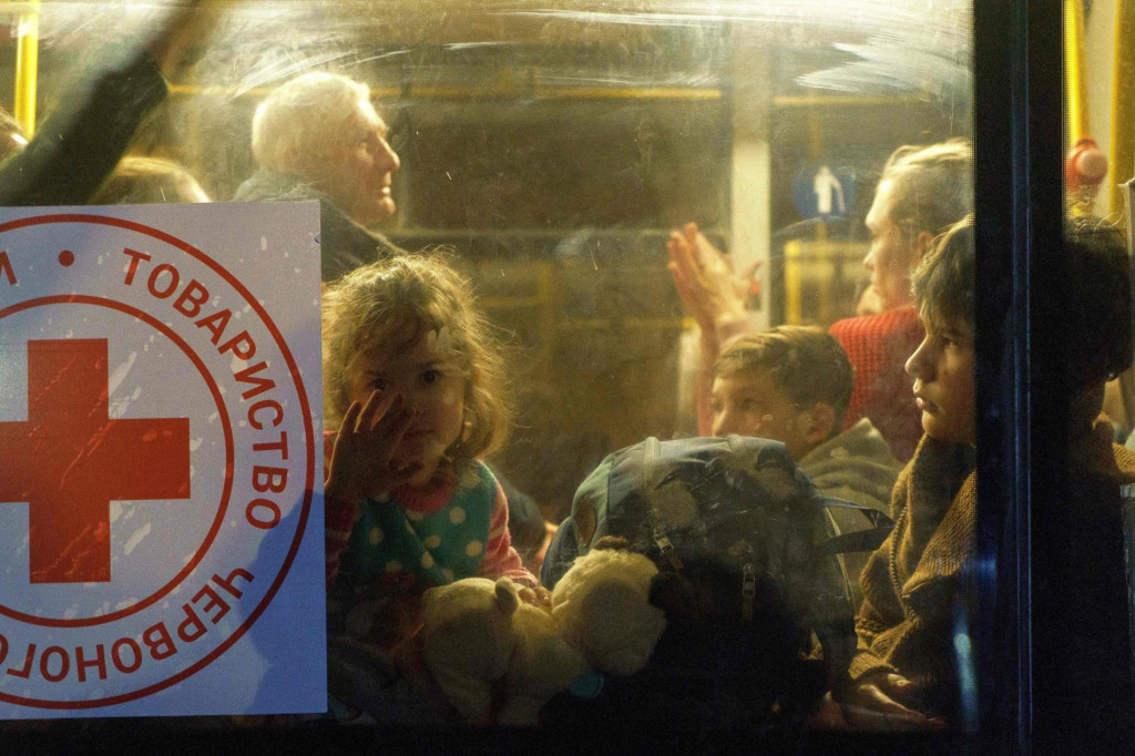 &lt;p&gt;TOPSHOT - A child looks through a bus window as a convoy of 30 buses carrying evacuees from Mariupol and Melitopol arrive at the registration center in Zaporizhzhia, on April 1, 2022. - Late on April 1, people who managed to flee Mariupol to Russian-occupied Berdiansk were from there carried on dozens of buses to Zaporizhzhia, some 200 kilometers (120 miles) to the northwest, according to an AFP reporter on the scene. (Photo by emre caylak/AFP)&lt;/p&gt;