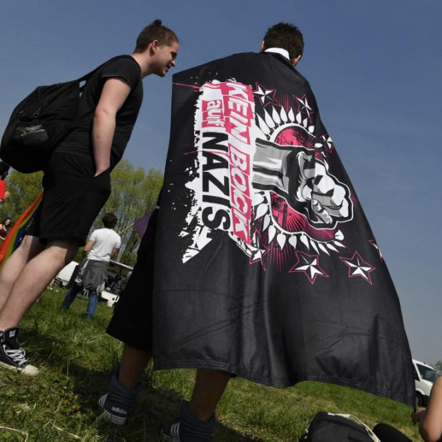 &lt;p&gt;A demonstrator wears a banner reading ”Nazis, No Way” at an ”anti-fascist” camp close to the Neisseblick Hotel where the ”Schild und Schwert” (Shield and Sword) neo-Nazi festival is taking place, in the small eastern German town of Ostritz on April 21, 2018. - Hundreds of neo-Nazis congregated on April 20, 2018, which marks Adolf Hitler&amp;#39;s birthday, and April 21, 2018 for a two-day festival in Ostritz, where anti-fascist groups have vowed counter-protests. (Photo by John MACDOUGALL/AFP)&lt;/p&gt;
