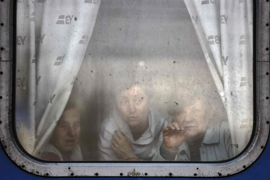 &lt;p&gt;TOPSHOT - Women wave to bid farewell to relatives as they are about to leave by train at Slovyansk central station, in the Donbass region on April 12, 2022, amid Russian invasion of Ukraine. - The Ukrainian leaders of the Donetsk and Lugansk regions in the Donbas have asked civilians to evacuate west in reaction to an anticipated Russian offensive to take the eastern region. (Photo by RONALDO SCHEMIDT/AFP)&lt;/p&gt;