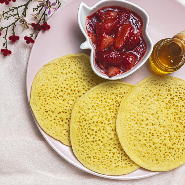 &lt;p&gt;Homemade traditional moroccan baghrir with honey, strawberries and mint. Moroccan Pancakes from above&lt;/p&gt;