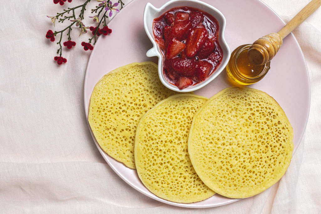 &lt;p&gt;Homemade traditional moroccan baghrir with honey, strawberries and mint. Moroccan Pancakes from above&lt;/p&gt;