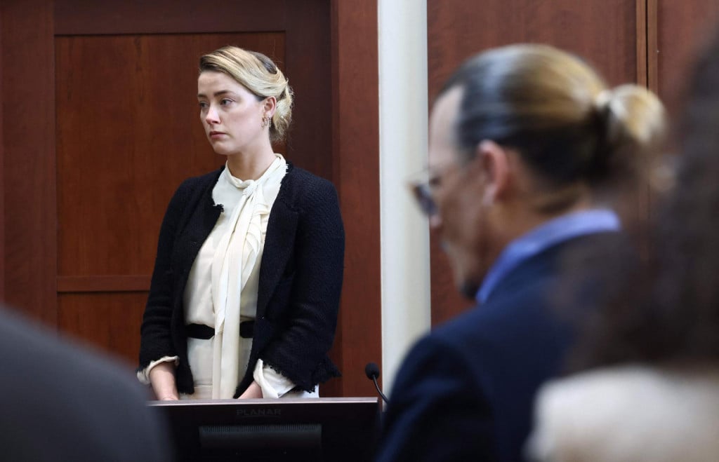 &lt;p&gt;US actress Amber Heard (L) testifies as US actor Johnny Depp looks on during a defamation trial at the Fairfax County Circuit Courthouse in Fairfax, Virginia, on May 5, 2022. - Actor Johnny Depp is suing ex-wife Amber Heard for libel after she wrote an op-ed piece in The Washington Post in 2018 referring to herself as a �public figure representing domestic abuse.� (Photo by Jim LO SCALZO/POOL/AFP)&lt;/p&gt;